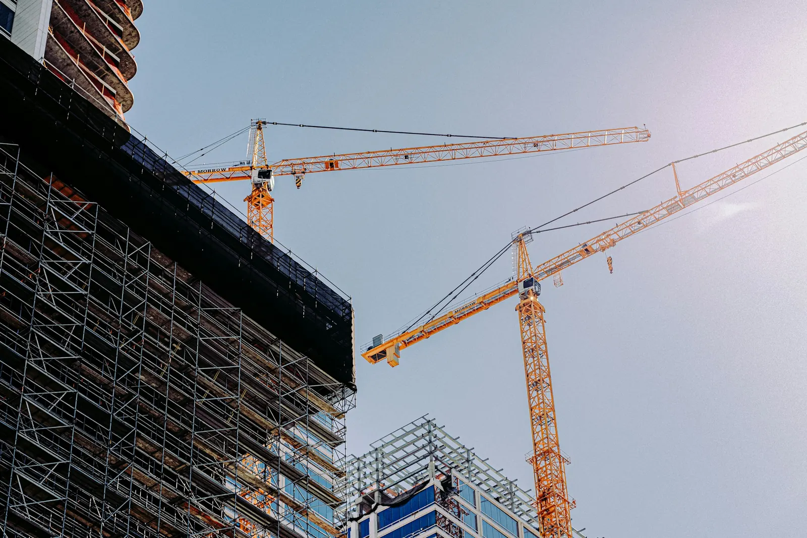 Cranes over a commercial building under construction