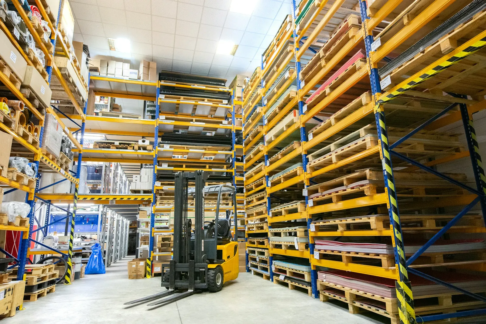 Warehouse racking with a forklift