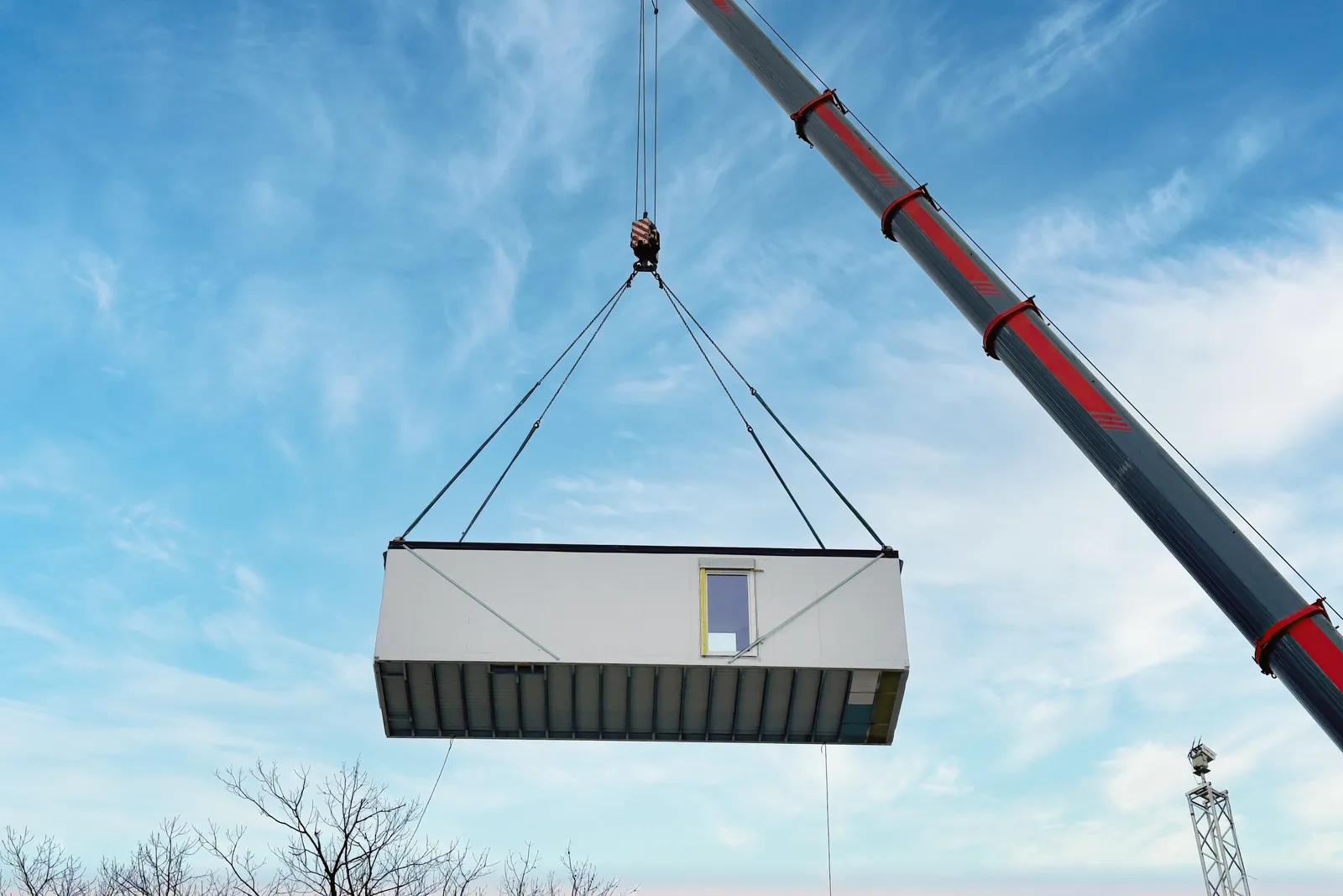 Crane lifting a prefabricated modular building unit