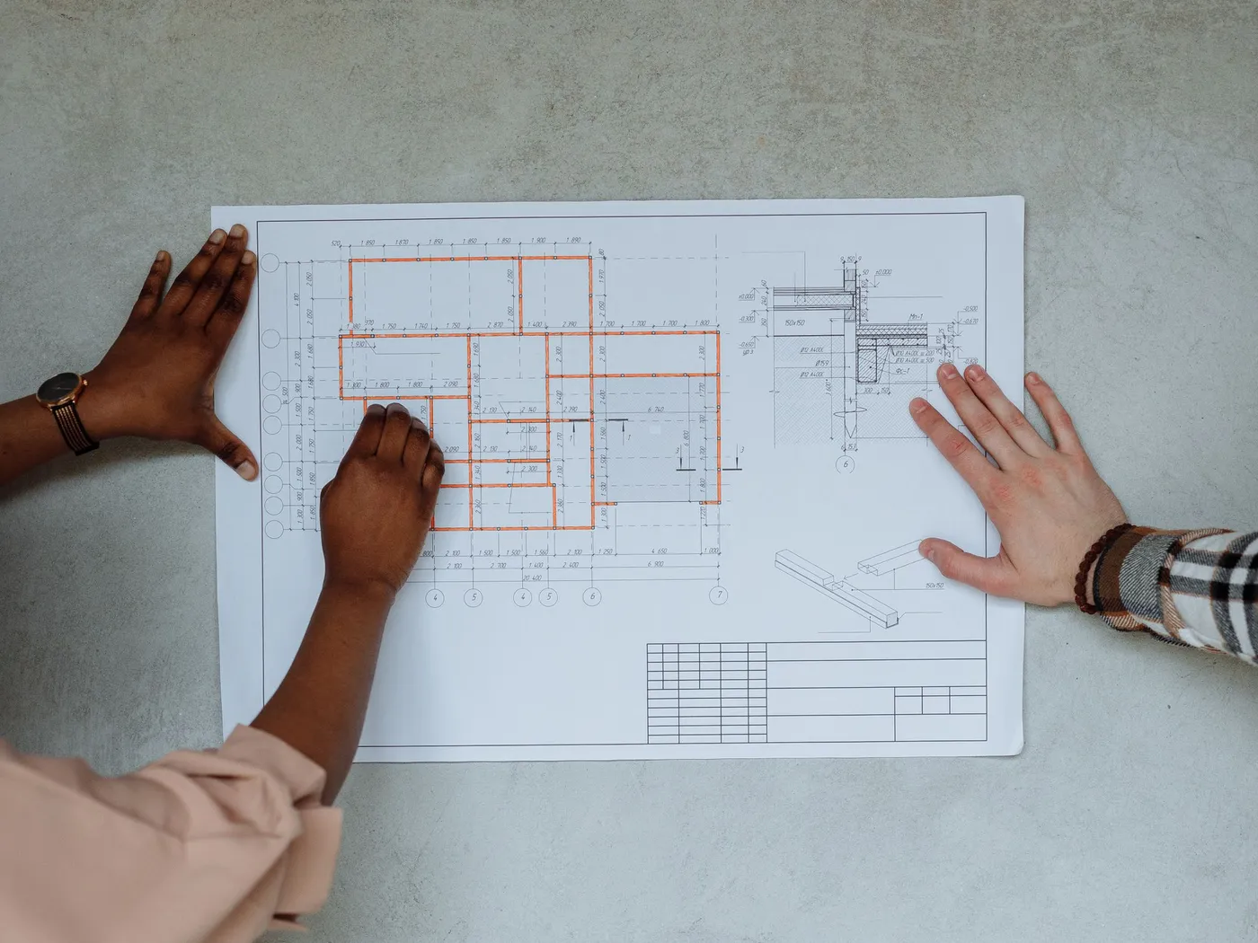 Site team reviewing construction drawings